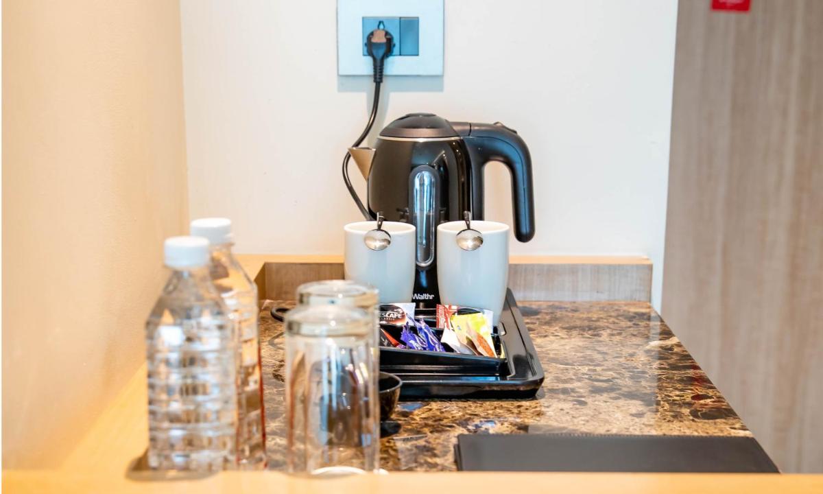 a coffee maker sitting on top of a kitchen counter at Holiday Inn Chennai OMR IT Expressway by IHG in Chennai