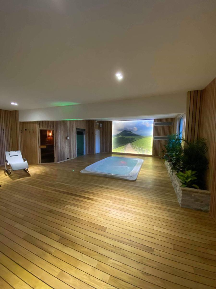 Un ou plusieurs lits dans un hébergement de l'établissement Maison Legate "Hôtel Le Baudiere & Spa"