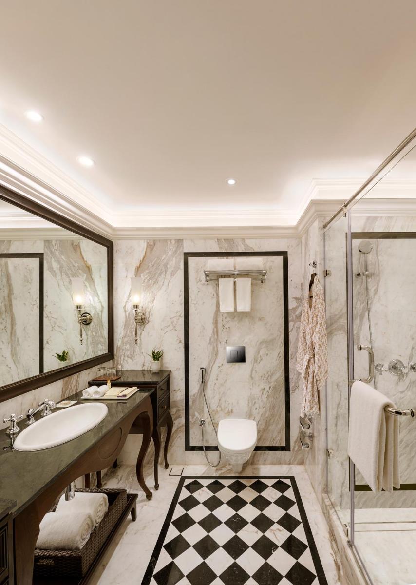 a bathroom with a sink and a toilet and a shower at Aurika, Udaipur - Luxury by Lemon Tree Hotels in Udaipur