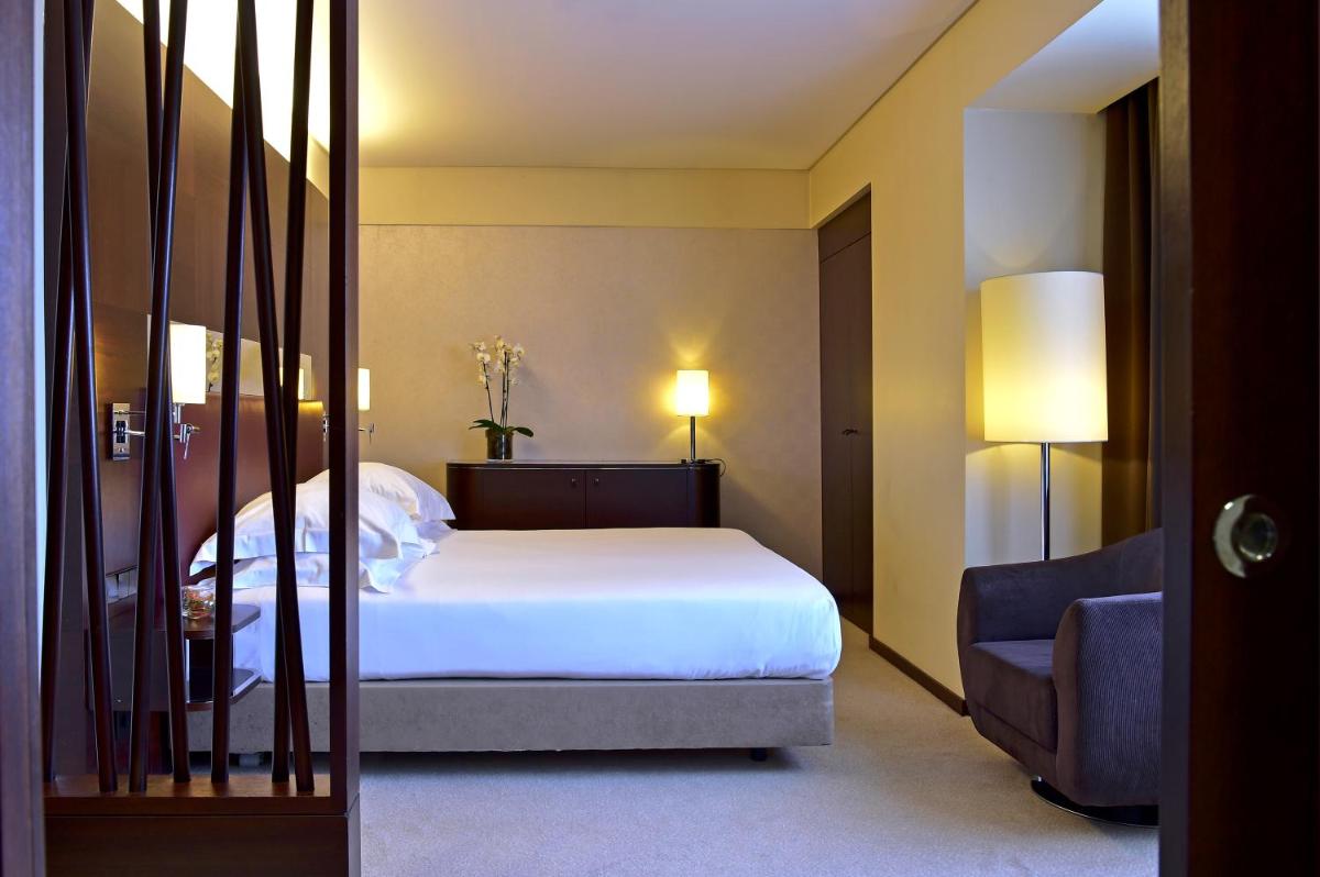 Uma cama ou camas num quarto em Porto Palácio Hotel by The Editory