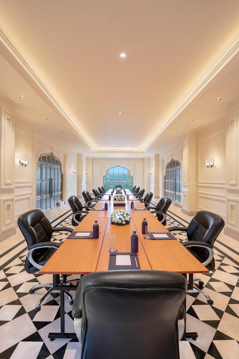 a large conference room with a long table and chairs at Aurika, Udaipur - Luxury by Lemon Tree Hotels in Udaipur
