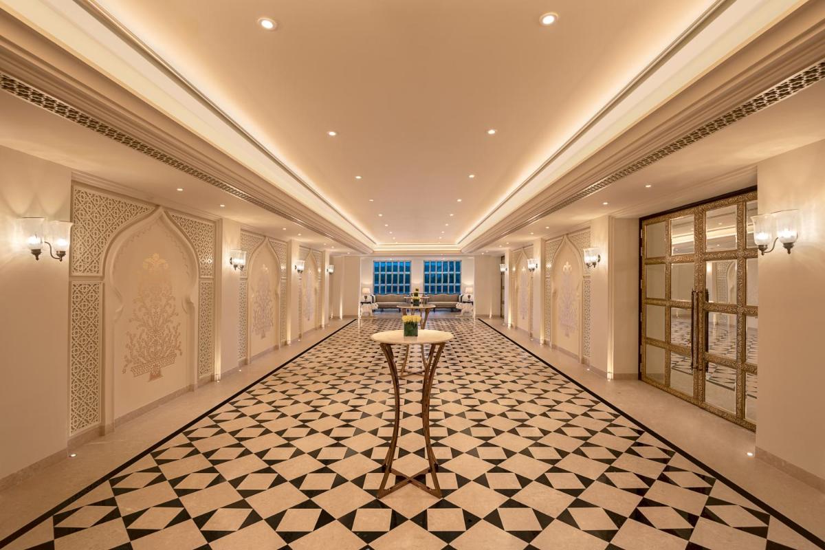 a hallway with a table in the middle of a building at Aurika, Udaipur - Luxury by Lemon Tree Hotels in Udaipur