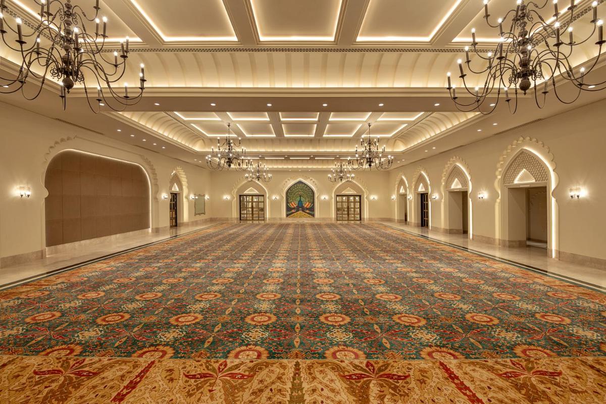 an empty ballroom with a large rug on the floor at Aurika, Udaipur - Luxury by Lemon Tree Hotels in Udaipur