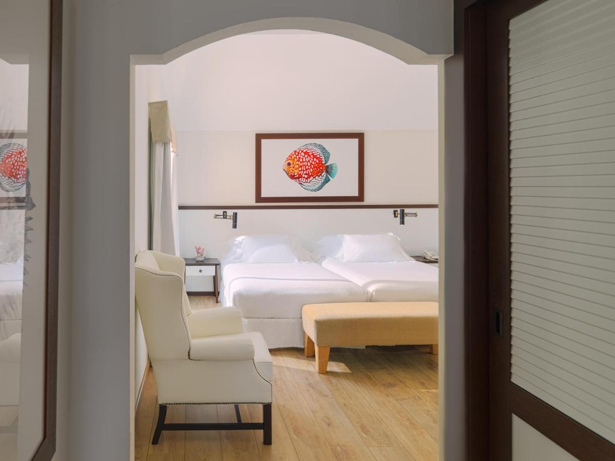 Cama o camas de una habitación en H10 Playa Esmeralda - Adults Only