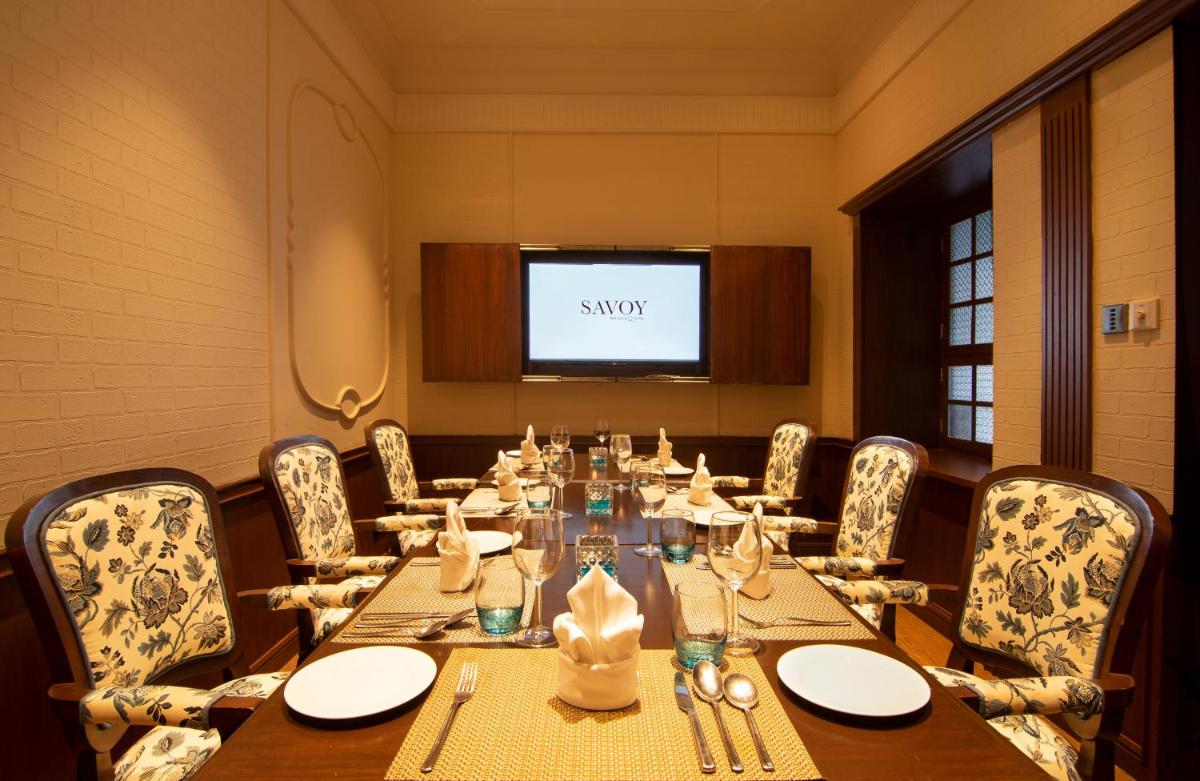 a conference room with a long table and chairs at Savoy - IHCL SeleQtions in Ooty
