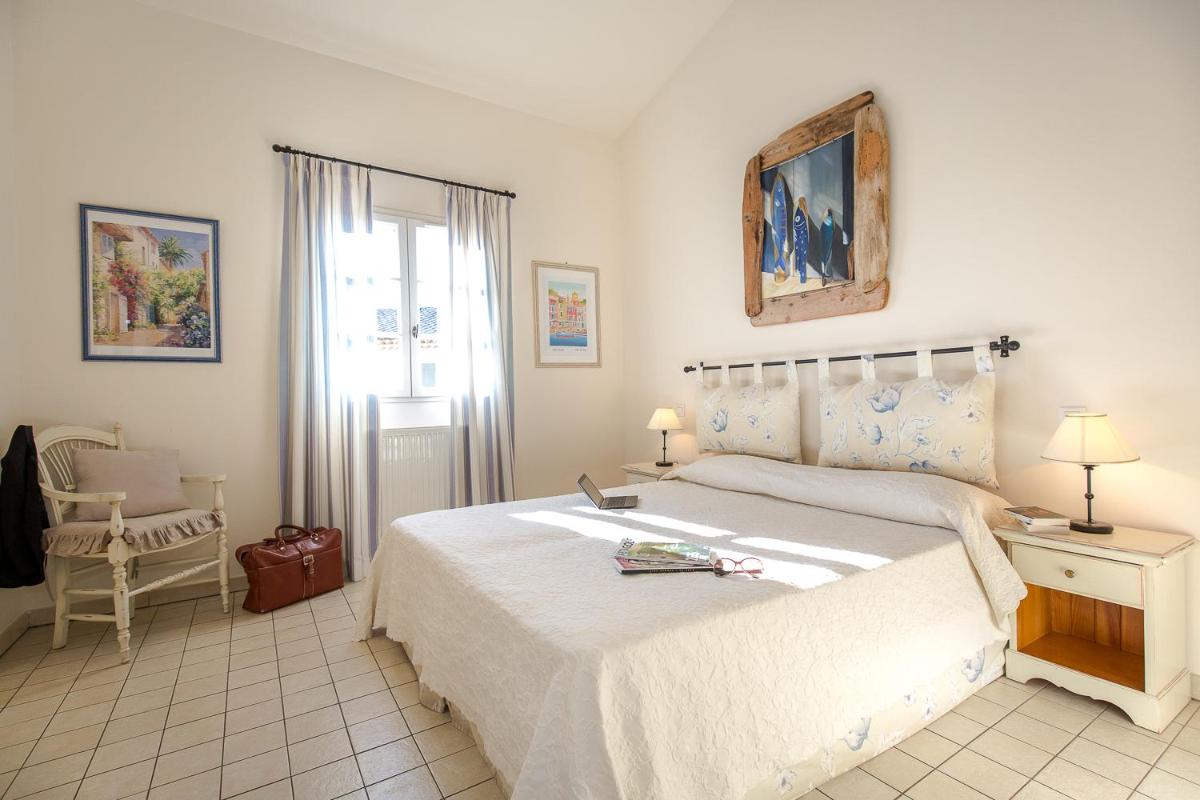 Un ou plusieurs lits dans un hébergement de l'établissement Les Appartements et Maisons du Domaine de Saint Endréol Golf & Spa Resort