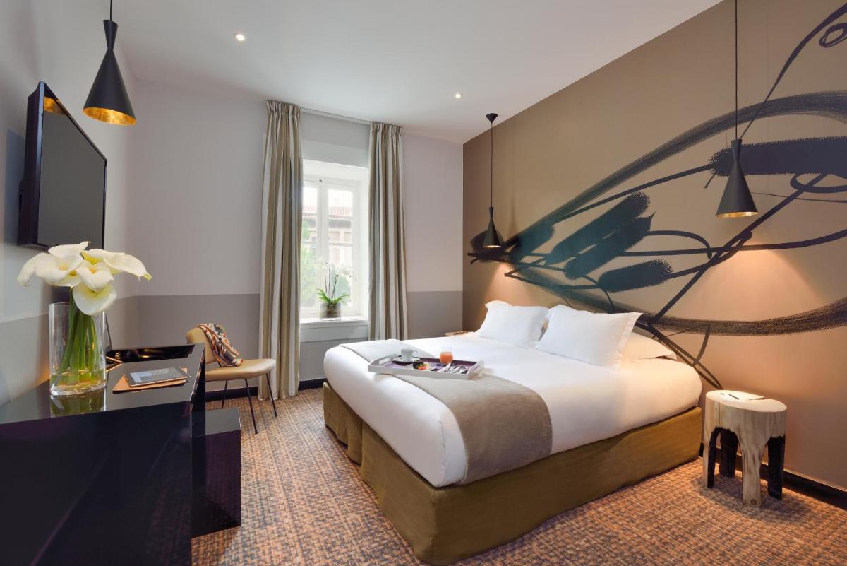 Un ou plusieurs lits dans un hébergement de l'établissement Jules César Hotel & Spa Arles - MGallery Collection