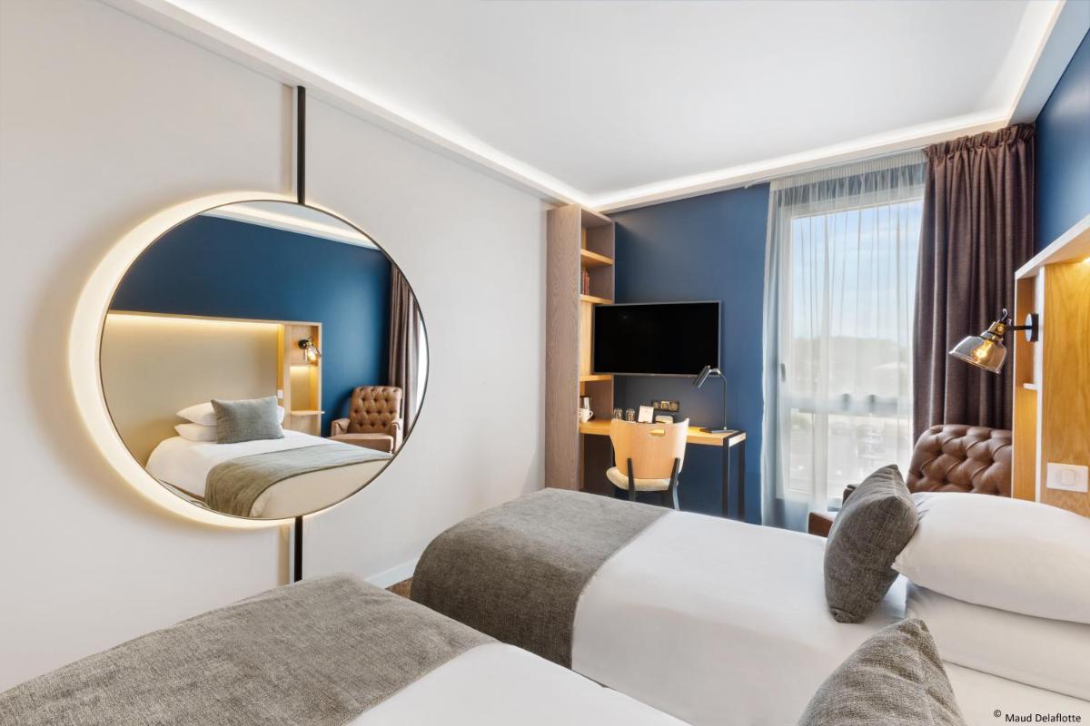 Un ou plusieurs lits dans un hébergement de l'établissement Aiden by Best Western T'aim Hotel & SPA