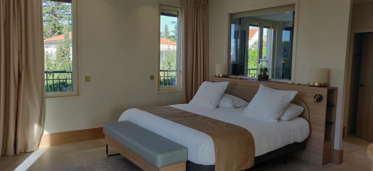 Un ou plusieurs lits dans un hébergement de l'établissement Splendid Hôtel & Spa