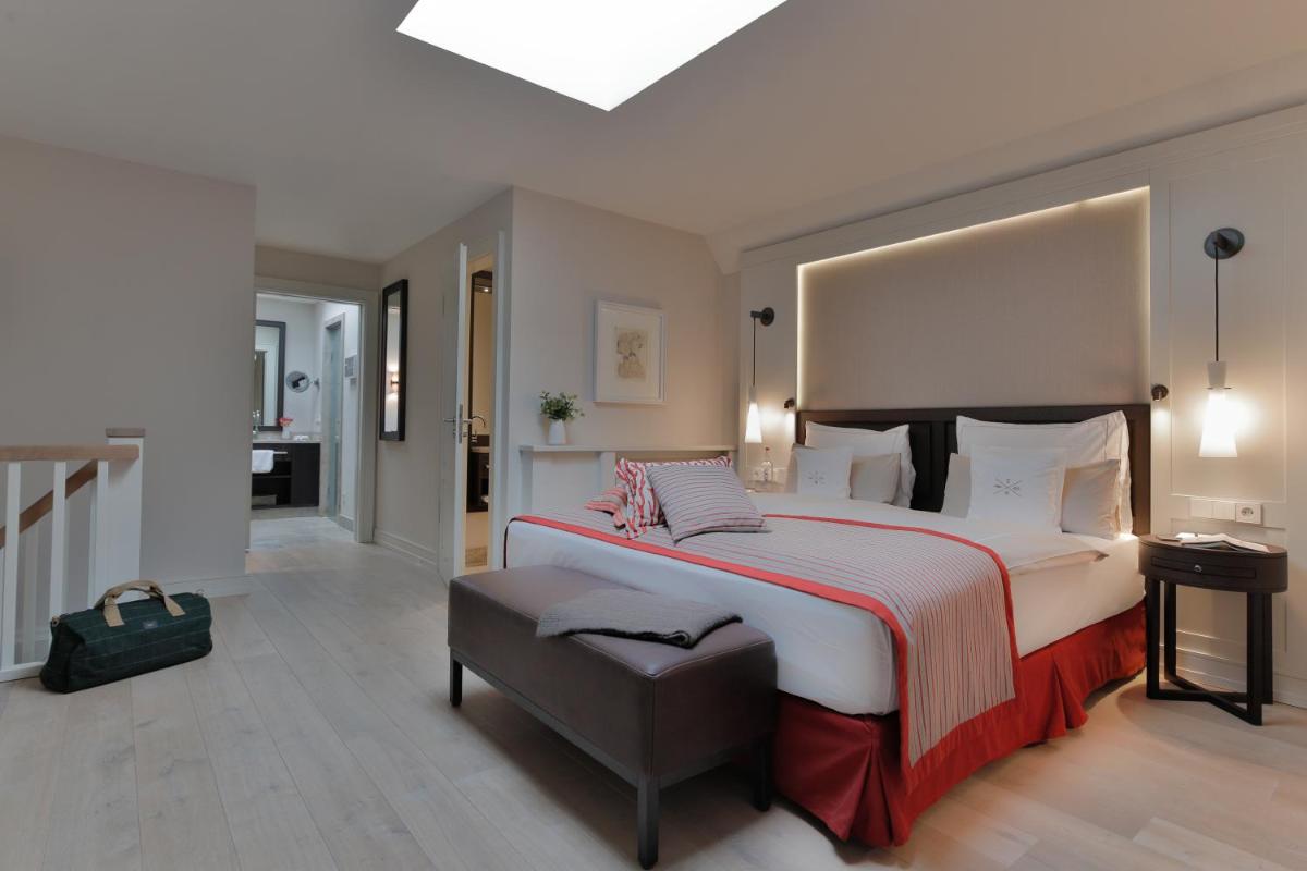 Ein Bett oder Betten in einem Zimmer der Unterkunft Severin's Resort & Spa