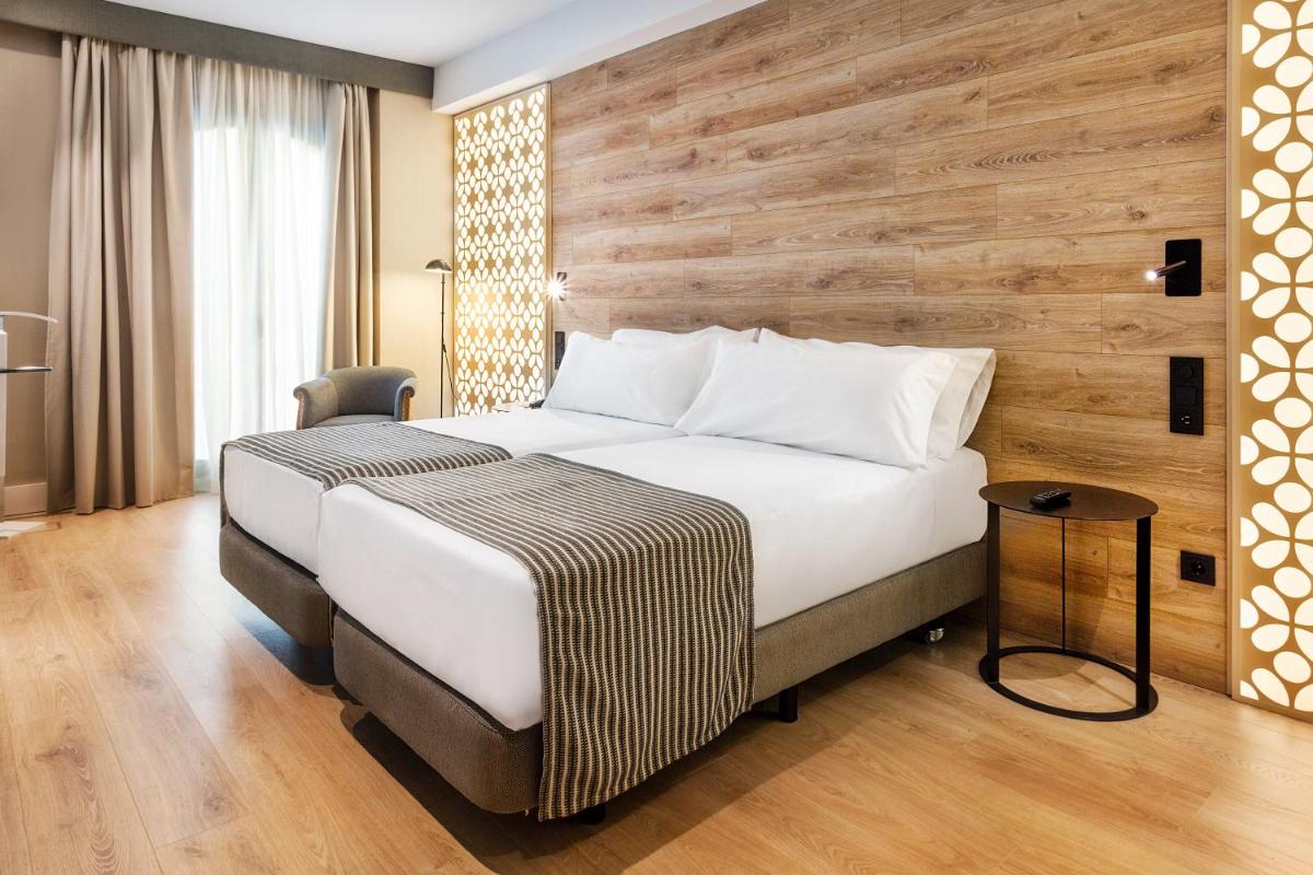Cama o camas de una habitación en Catalonia Santa Justa
