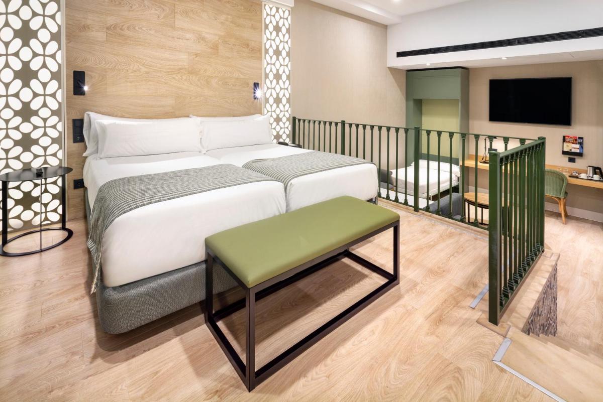 Cama o camas de una habitación en Catalonia Santa Justa