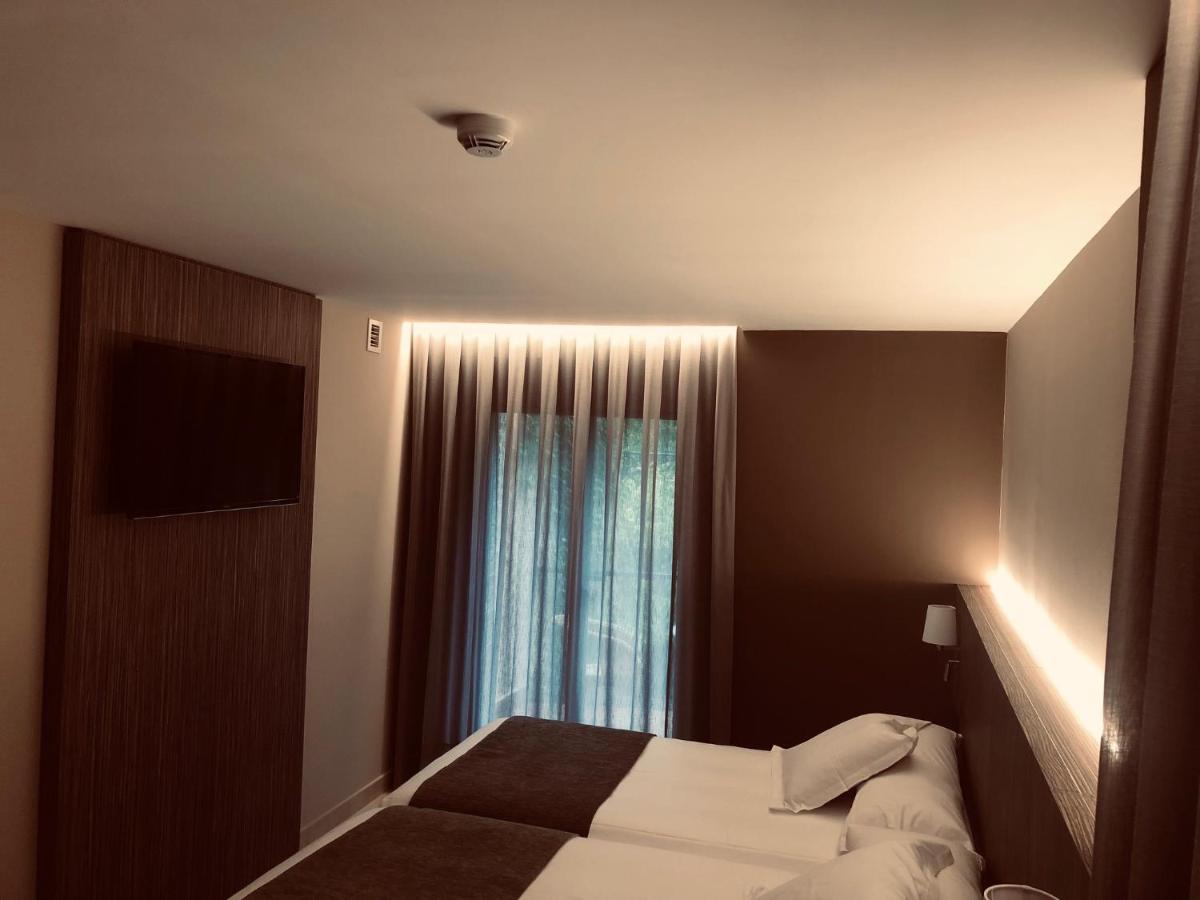 Cama o camas de una habitación en Hotel Balneario de La Virgen