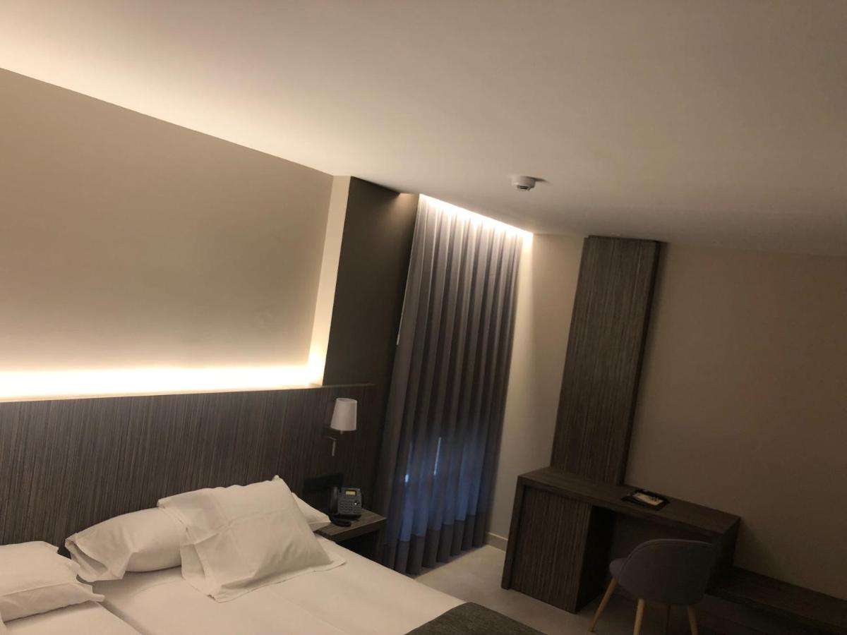 Cama o camas de una habitación en Hotel Balneario de La Virgen