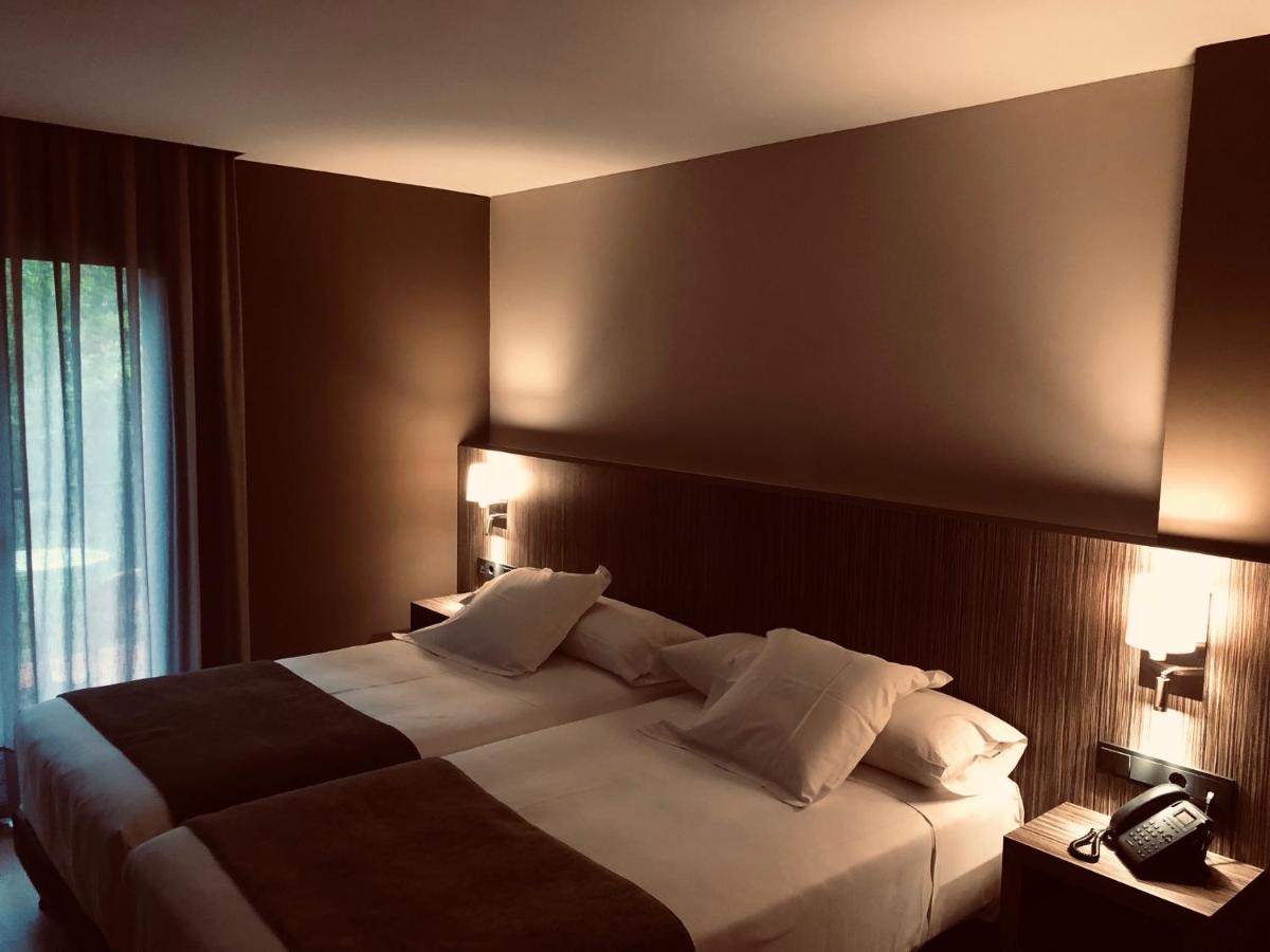 Cama o camas de una habitación en Hotel Balneario de La Virgen
