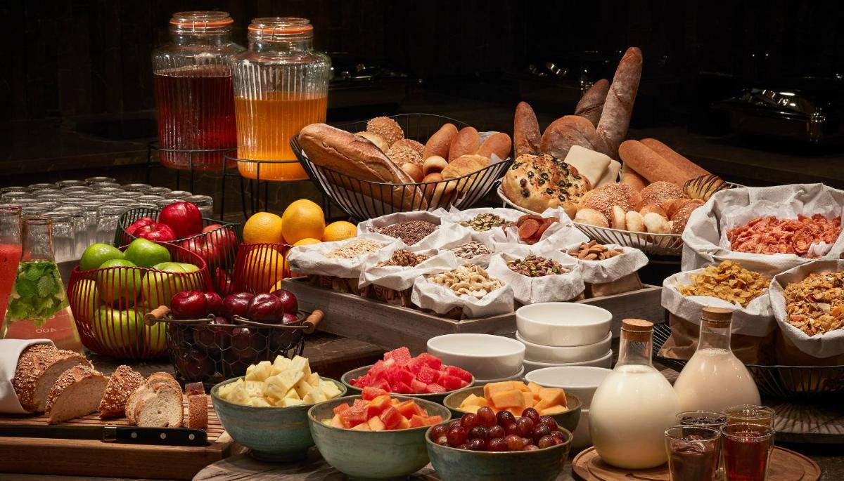 a table topped with lots of different types of food at Taj Tirupati in Tirupati