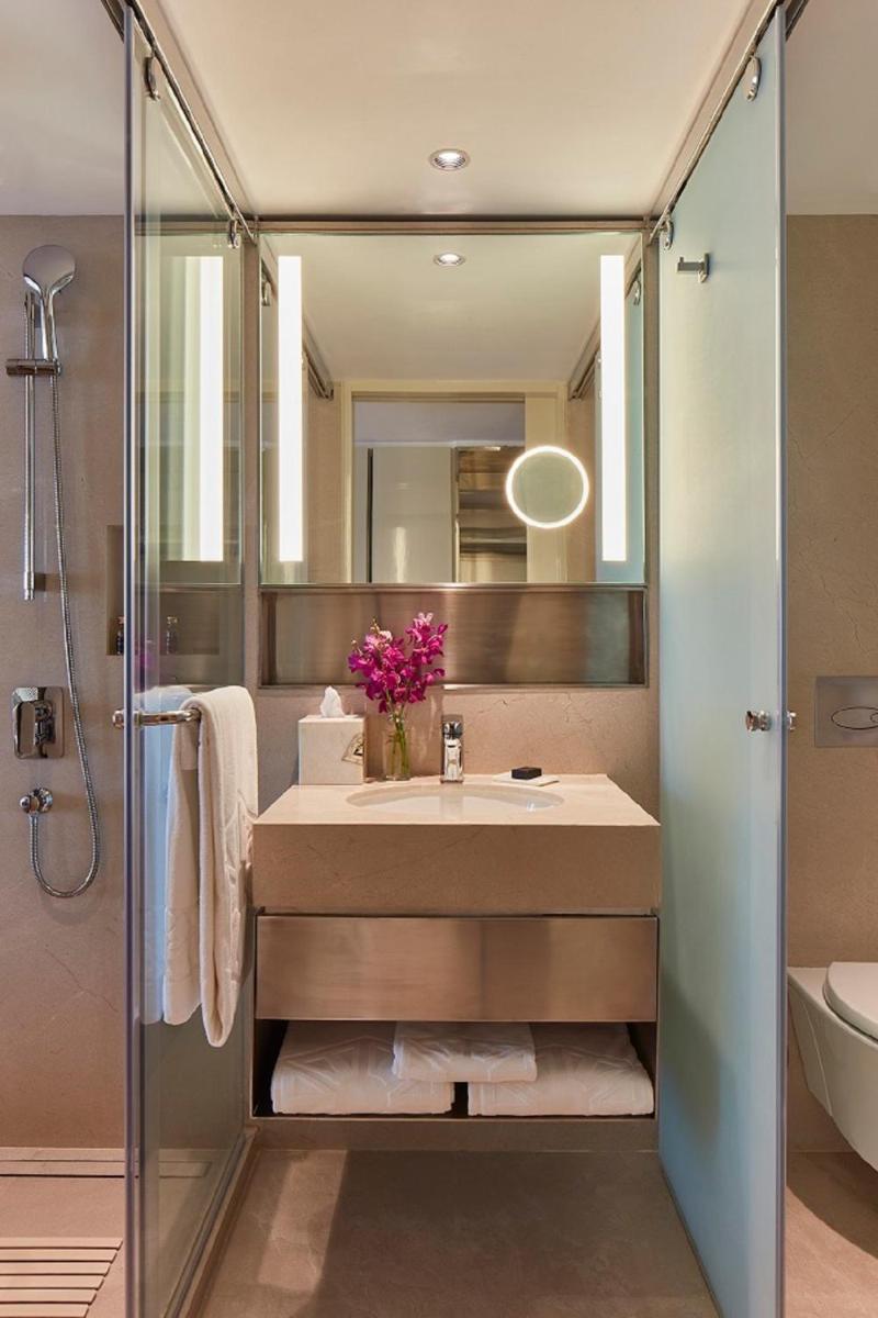 a bathroom with a sink and a shower at The Taj Mahal Tower, Mumbai in Mumbai a bathroom with a sink and a shower at The Taj Mahal Tower, Mumbai in Mumbai