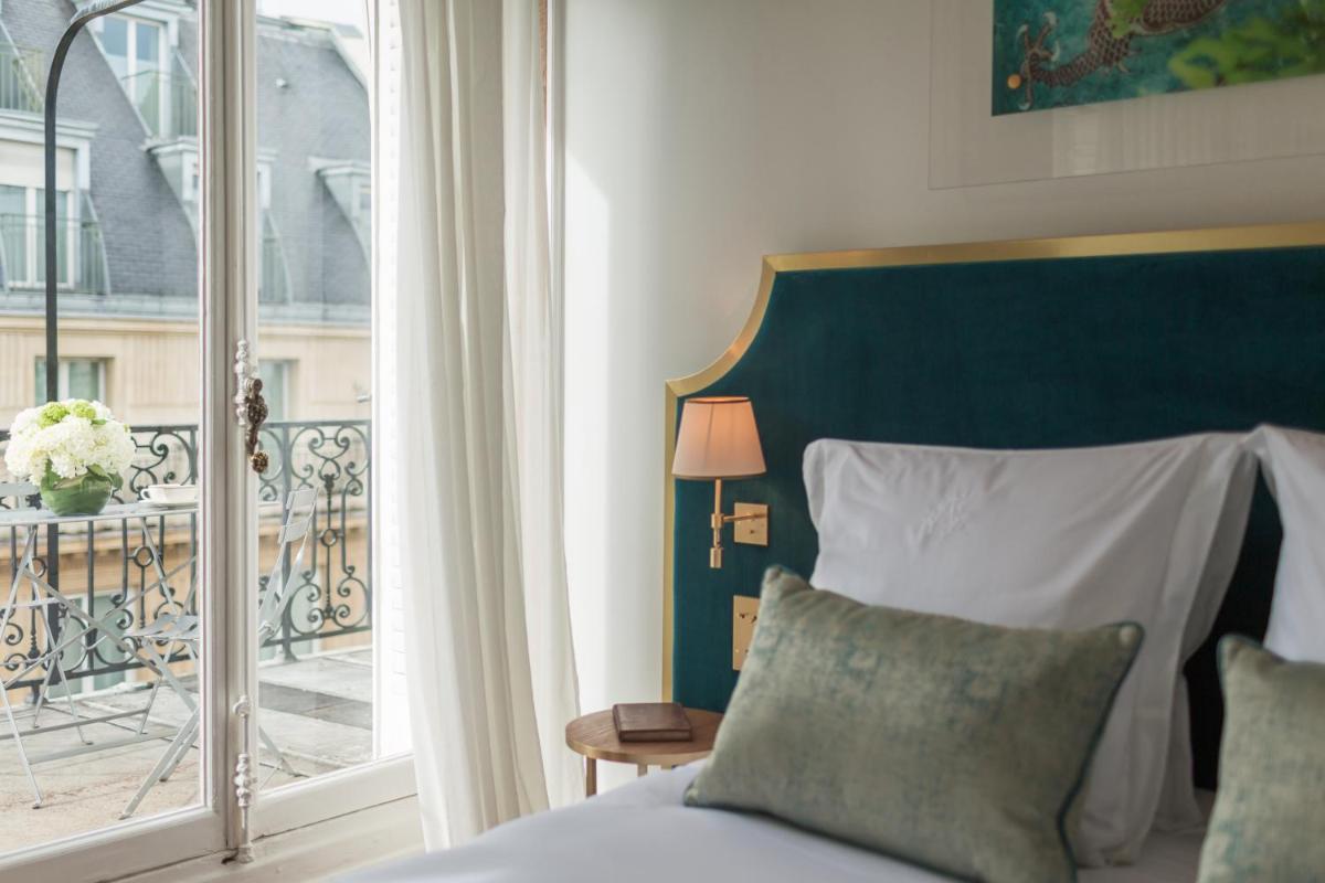 Un ou plusieurs lits dans un hébergement de l'établissement Hôtel Alfred Sommier