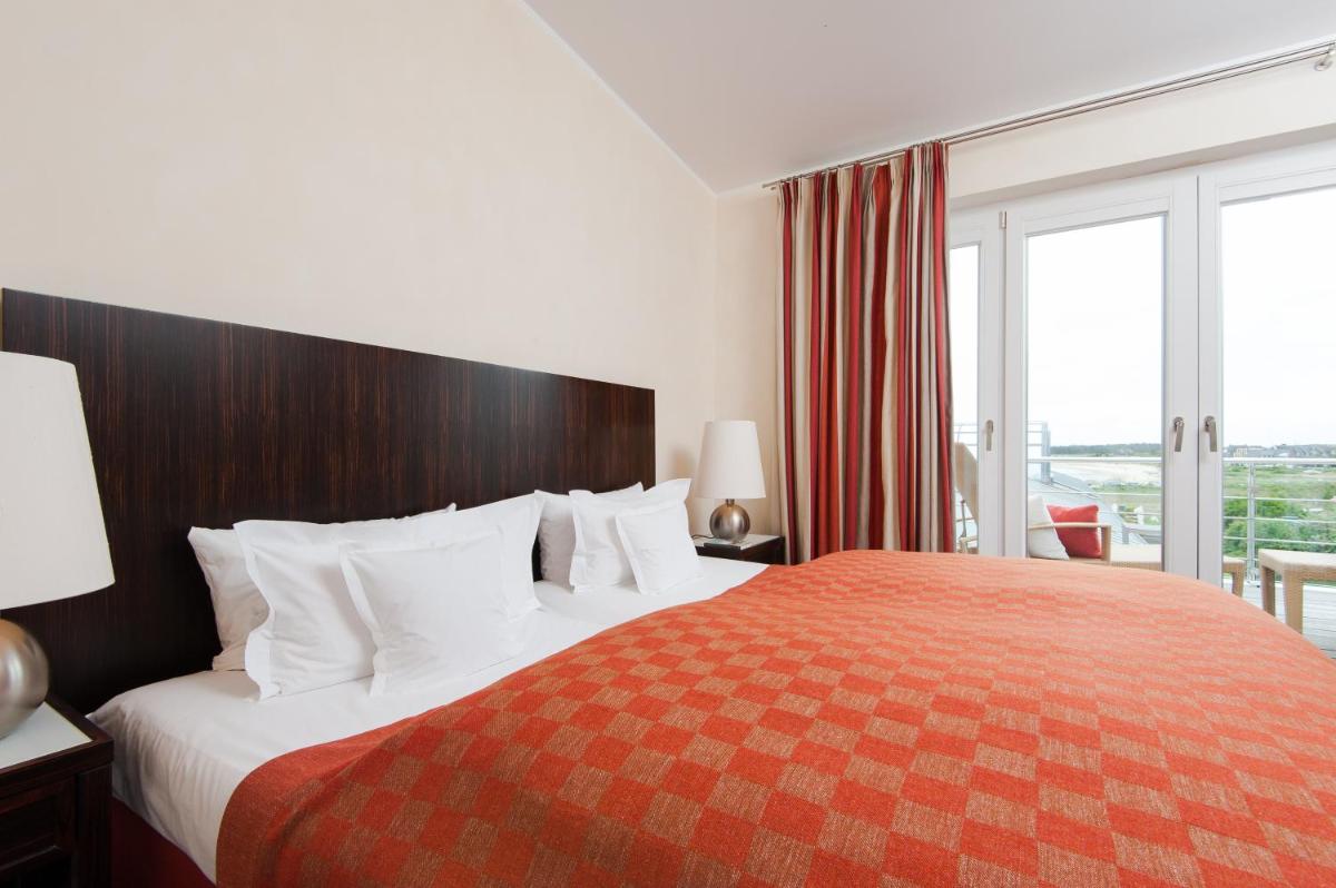 Ein Bett oder Betten in einem Zimmer der Unterkunft Hotel Fährhaus