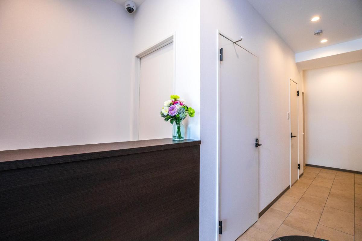 MrKINJO Miki24 in front of Makishi Station - Housity