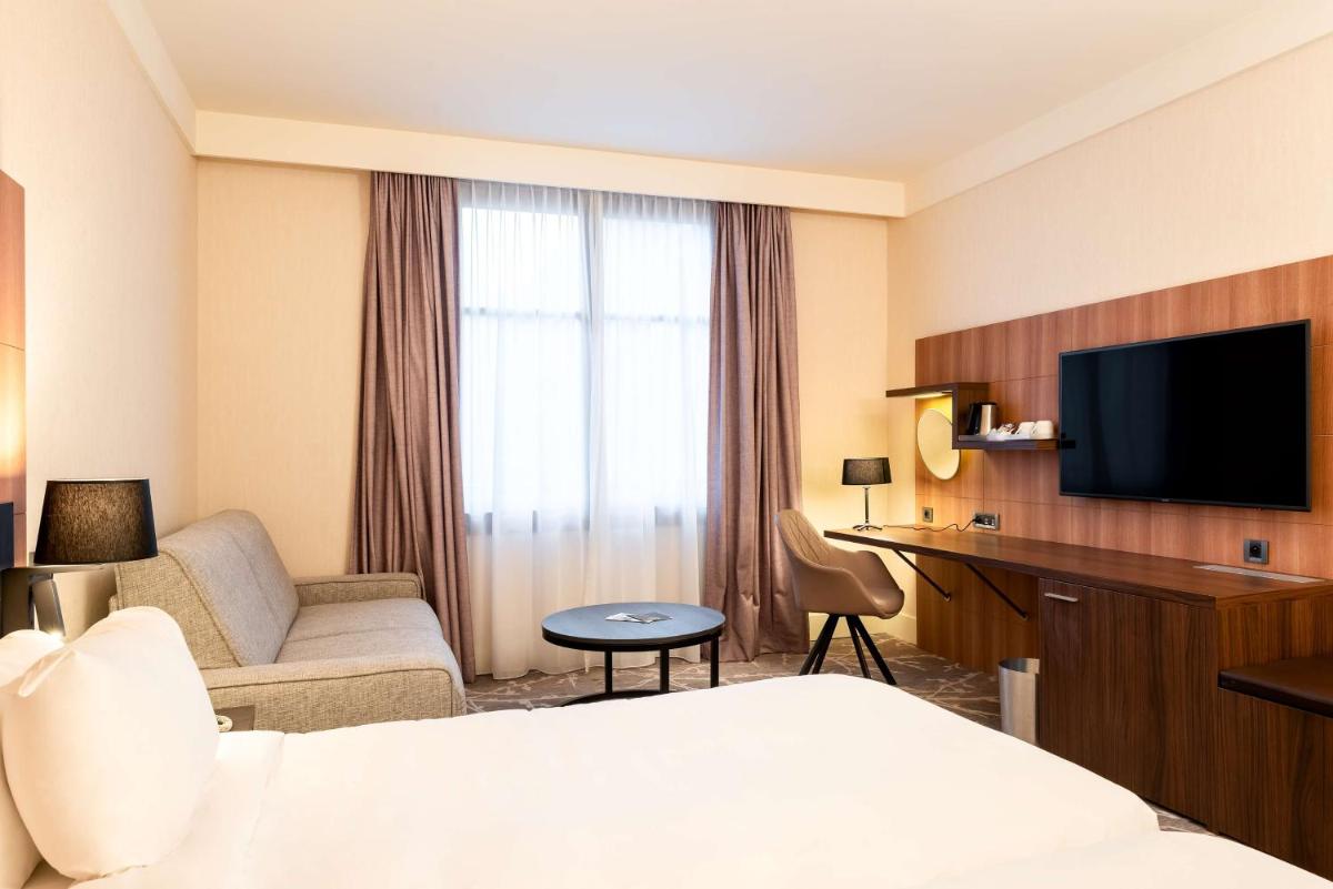 Télévision ou salle de divertissement dans l'établissement Hotel Paris Marne-la-Vallee by IHG