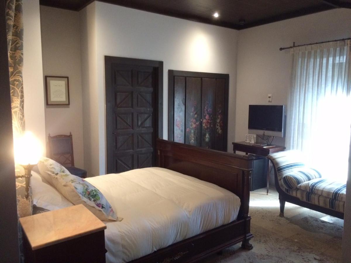Cama o camas de una habitación en Hotel Palacio de Mengibar