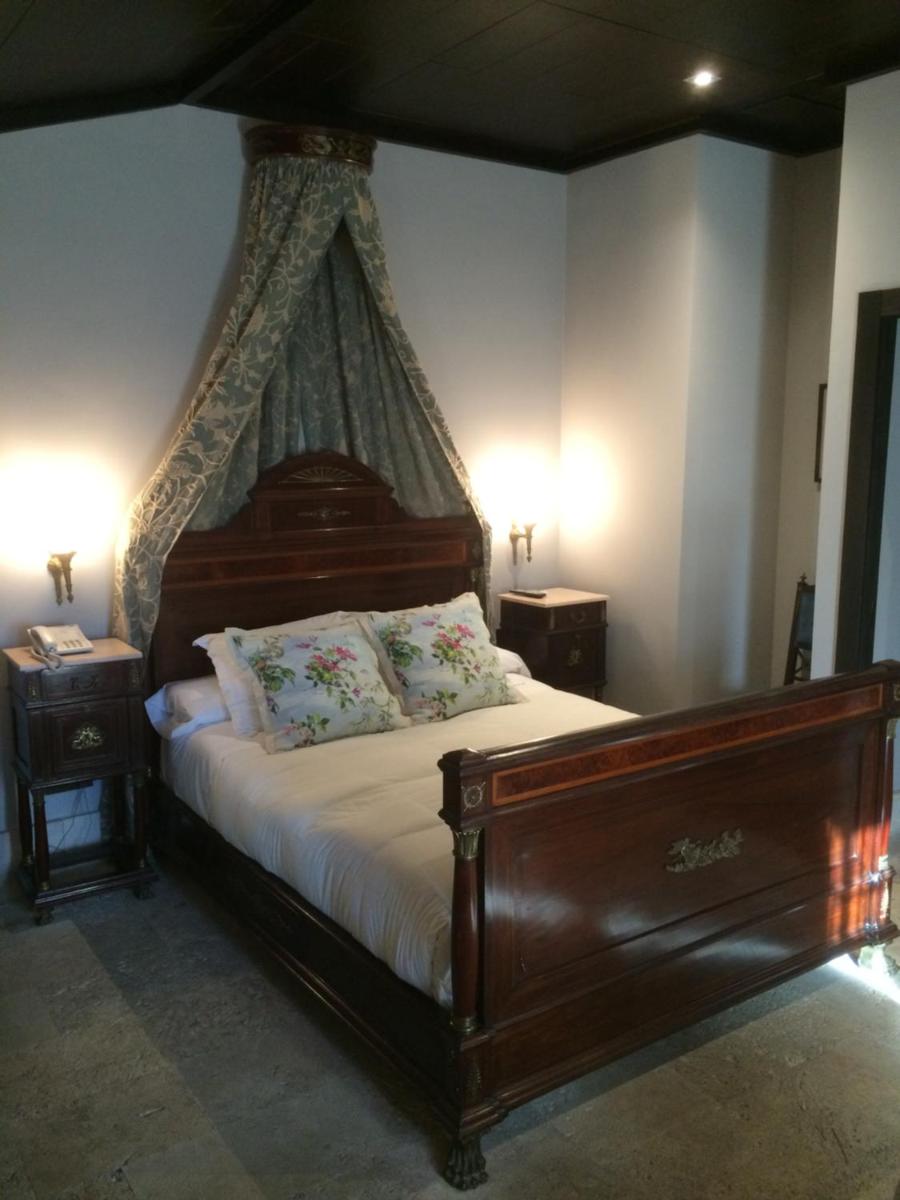Cama o camas de una habitación en Hotel Palacio de Mengibar