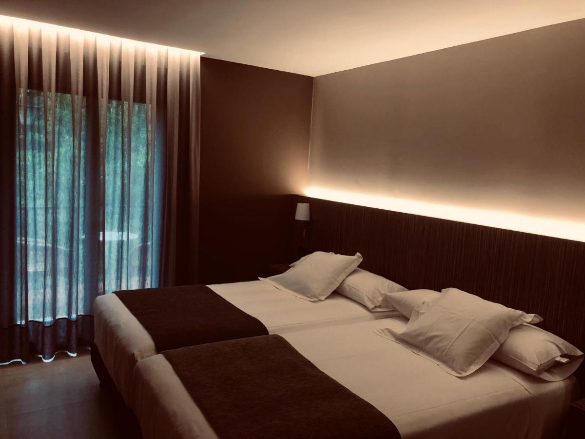 Cama o camas de una habitación en Hotel Balneario de La Virgen
