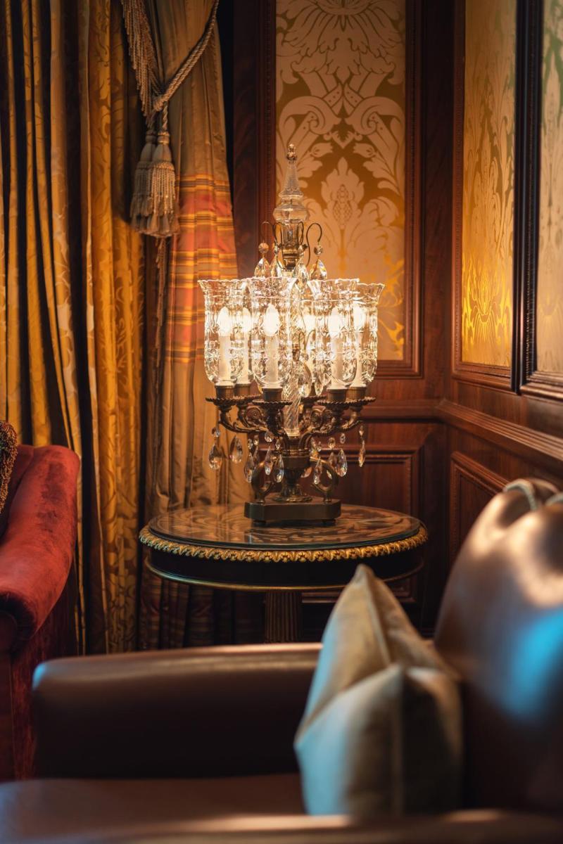 a chandelier sitting on a table in a room at The Leela Palace New Delhi in New Delhi a chandelier sitting on a table in a room at The Leela Palace New Delhi in New Delhi