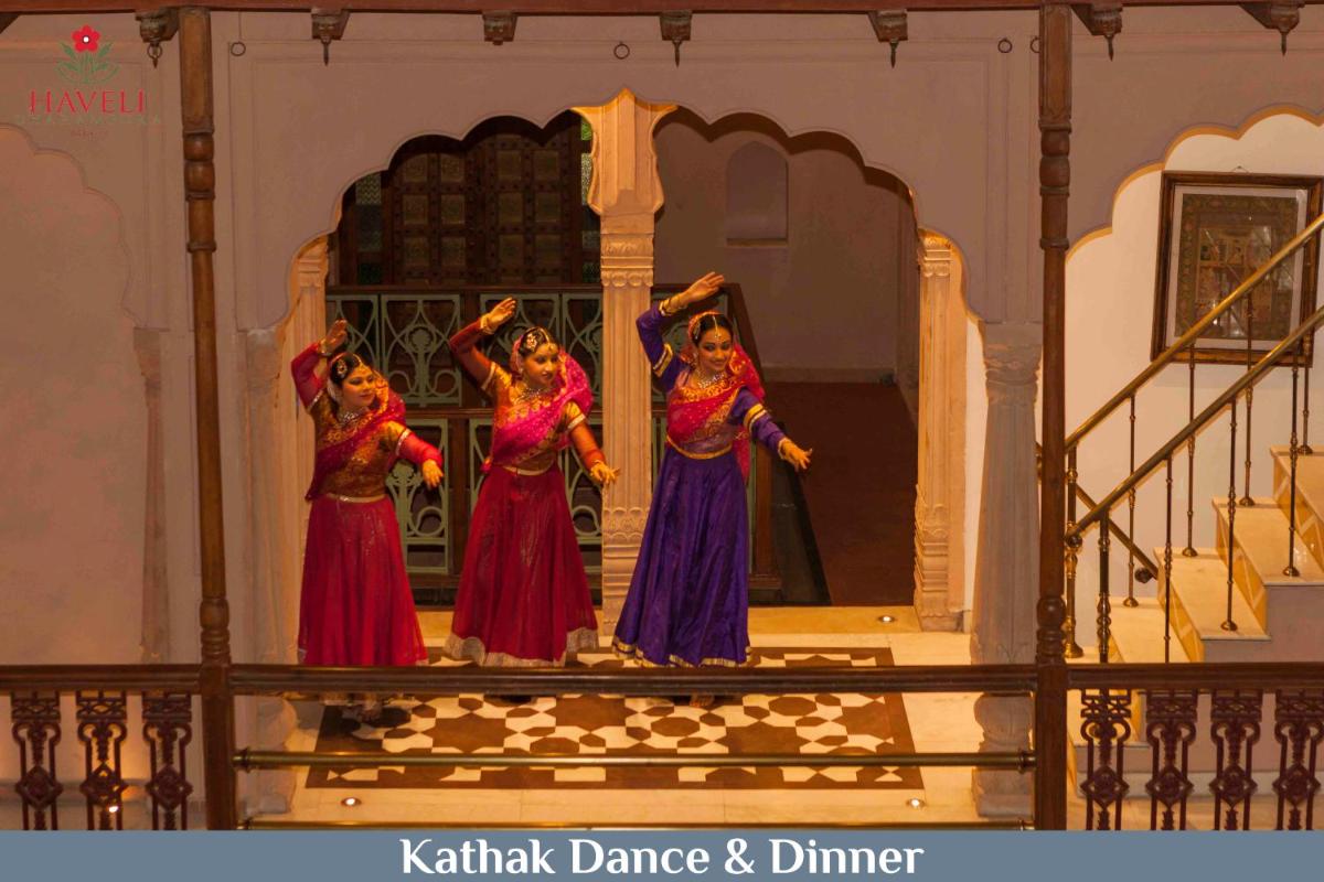 three women performing a dance on a stage at Haveli Dharampura & Golden Haveli- UNESCO awarded Boutique Heritage Hotel in New Delhi three women performing a dance on a stage at Haveli Dharampura & Golden Haveli- UNESCO awarded Boutique Heritage Hotel in New Delhi