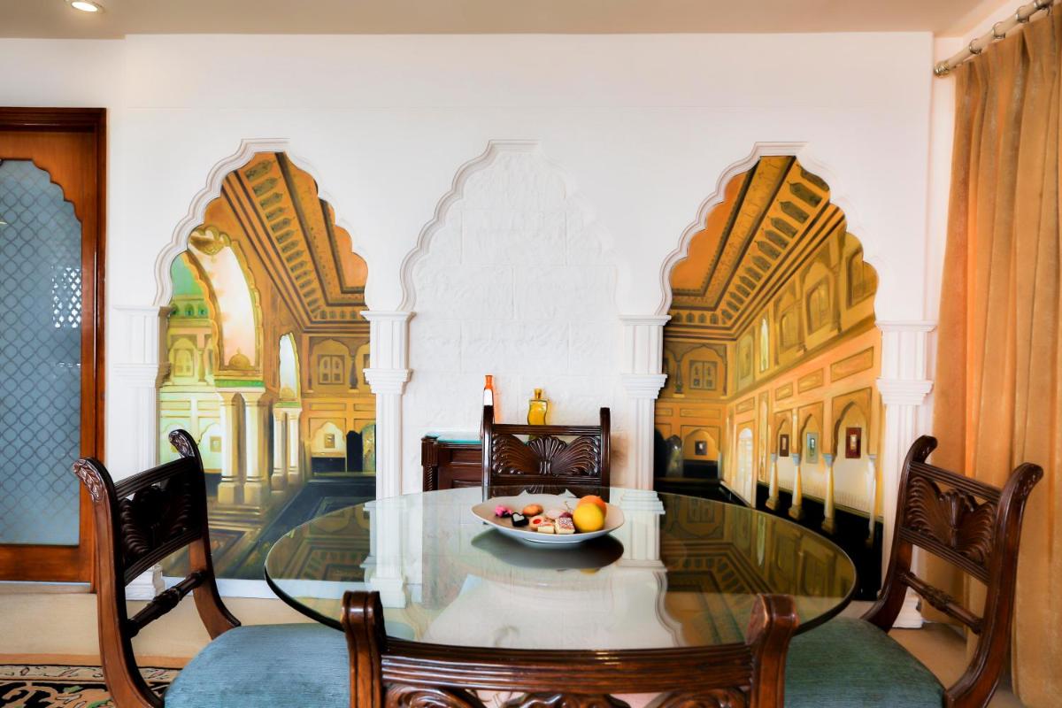 a dining room with a table with a bowl of fruit on it at Sun-n-Sand Mumbai Juhu Beach in Mumbai