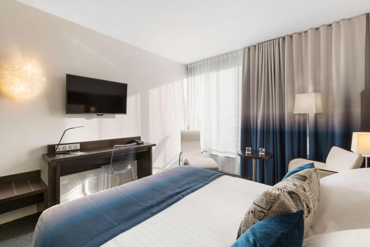 Un ou plusieurs lits dans un hébergement de l'établissement Best Western Plus Europe Hôtel Brest