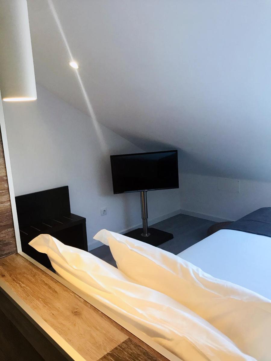 Uma televisão e/ou sistema de entretenimento em Promar - Eco Beach & Spa Hotel