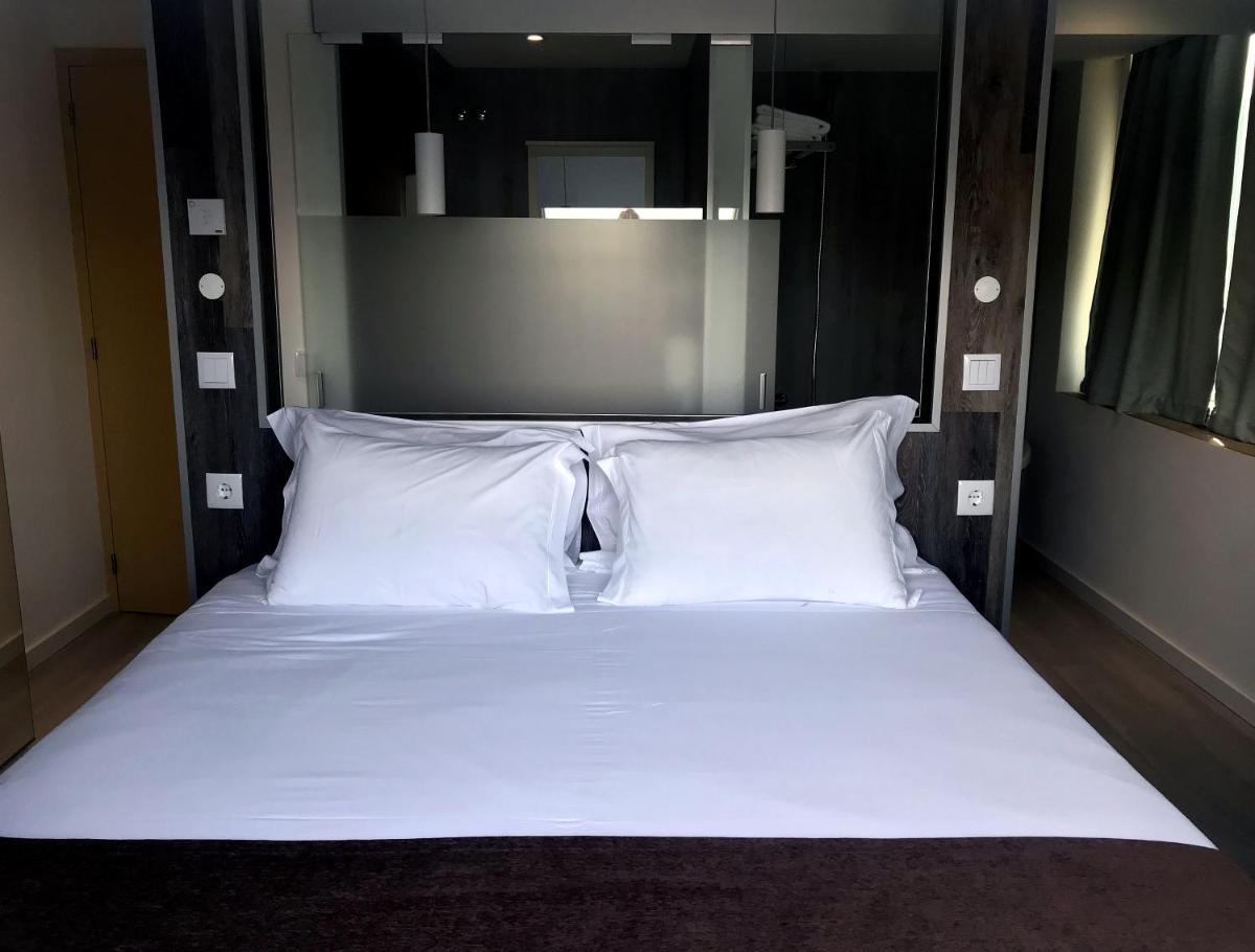 Uma cama ou camas num quarto em Promar - Eco Beach & Spa Hotel