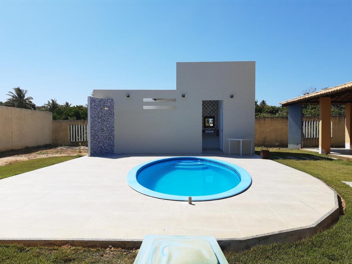 Casa de praia condomínio fechado, frente para o mar - Housity