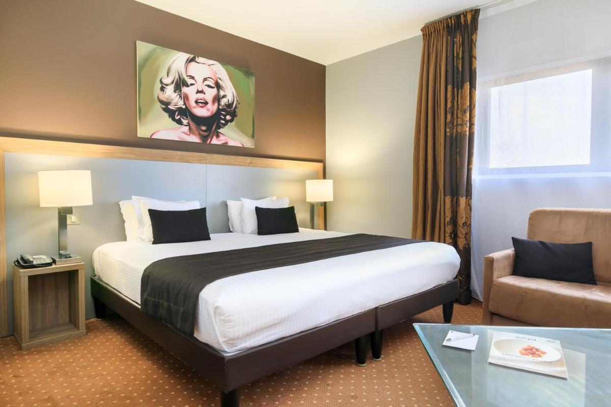 Un ou plusieurs lits dans un hébergement de l'établissement 7Hotel&Spa
