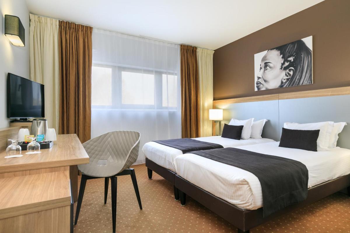 Un ou plusieurs lits dans un hébergement de l'établissement 7Hotel&Spa