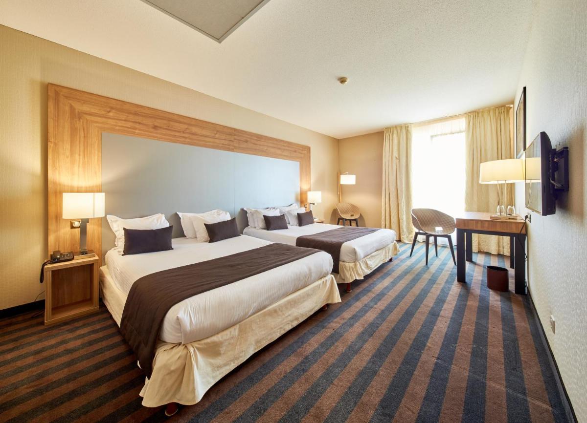 Un ou plusieurs lits dans un hébergement de l'établissement 7Hotel&Spa