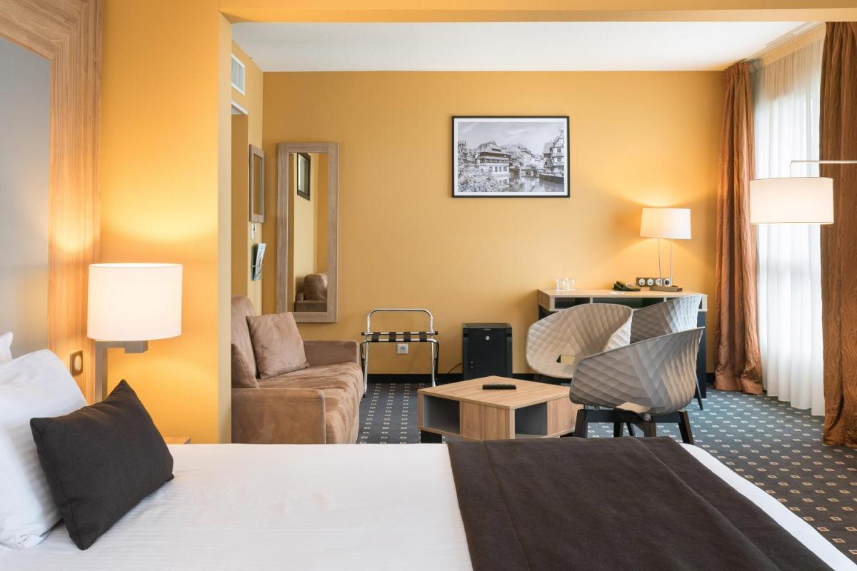 Un ou plusieurs lits dans un hébergement de l'établissement 7Hotel&Spa