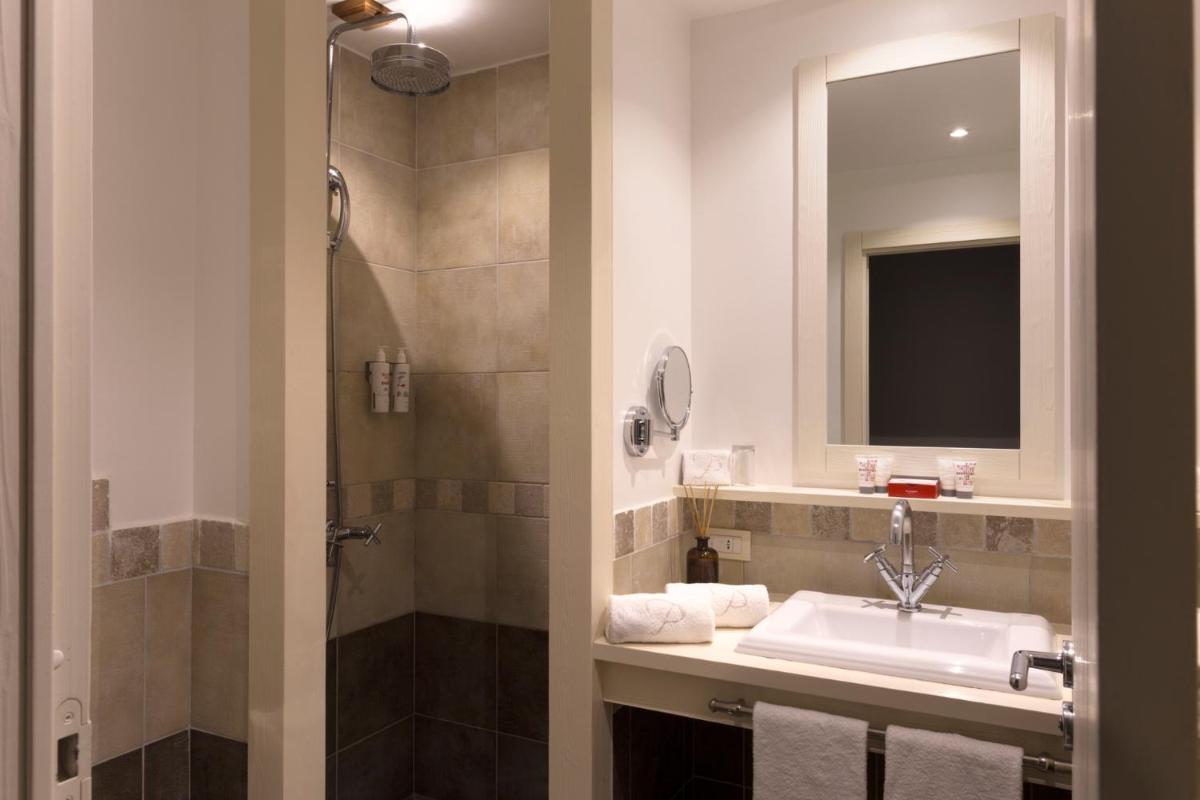 Salle de bains dans l'établissement Le Pinarello