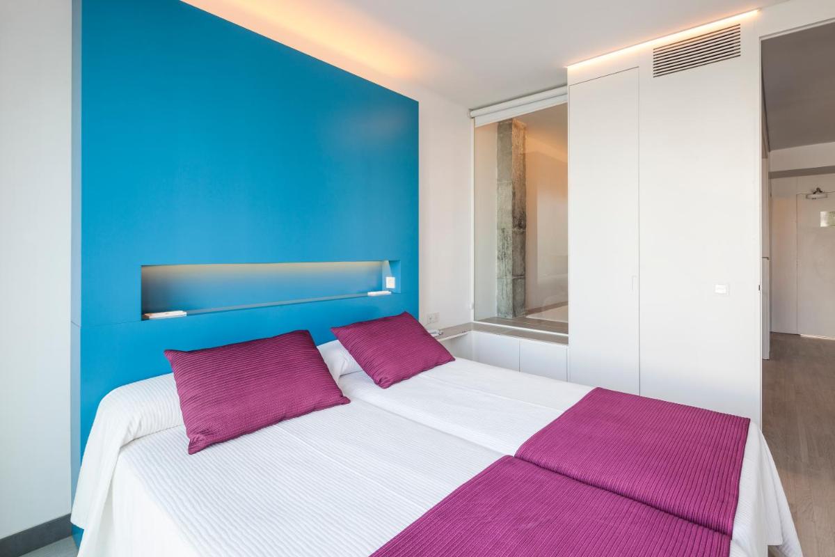 Cama o camas de una habitación en Ebano Hotel Apartments & Spa
