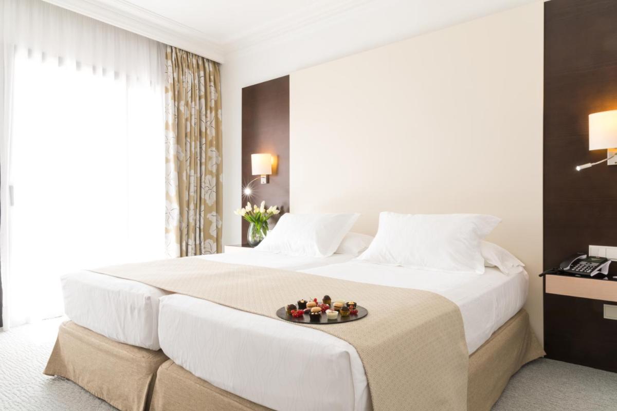 Cama o camas de una habitación en GPRO Valparaiso Palace & Spa