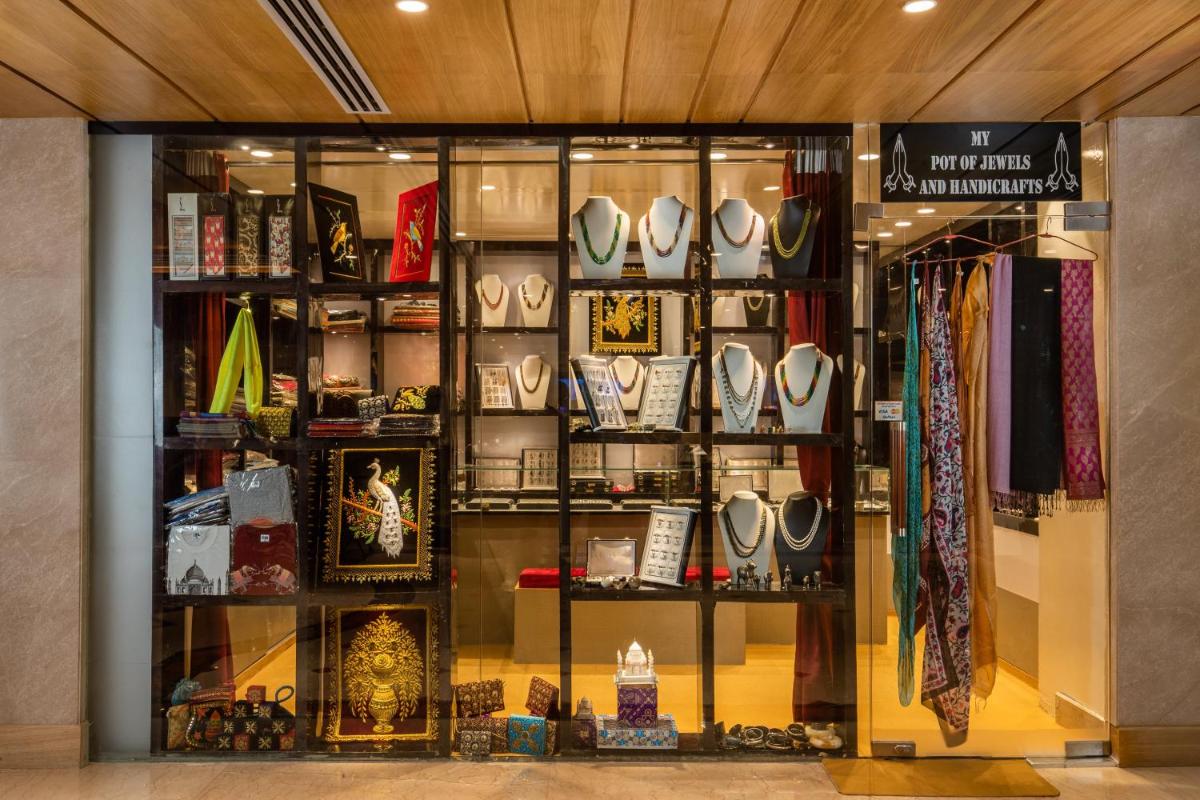 a store window with a lot of items on display at Holiday Inn Agra MG Road an IHG Hotel in Agra