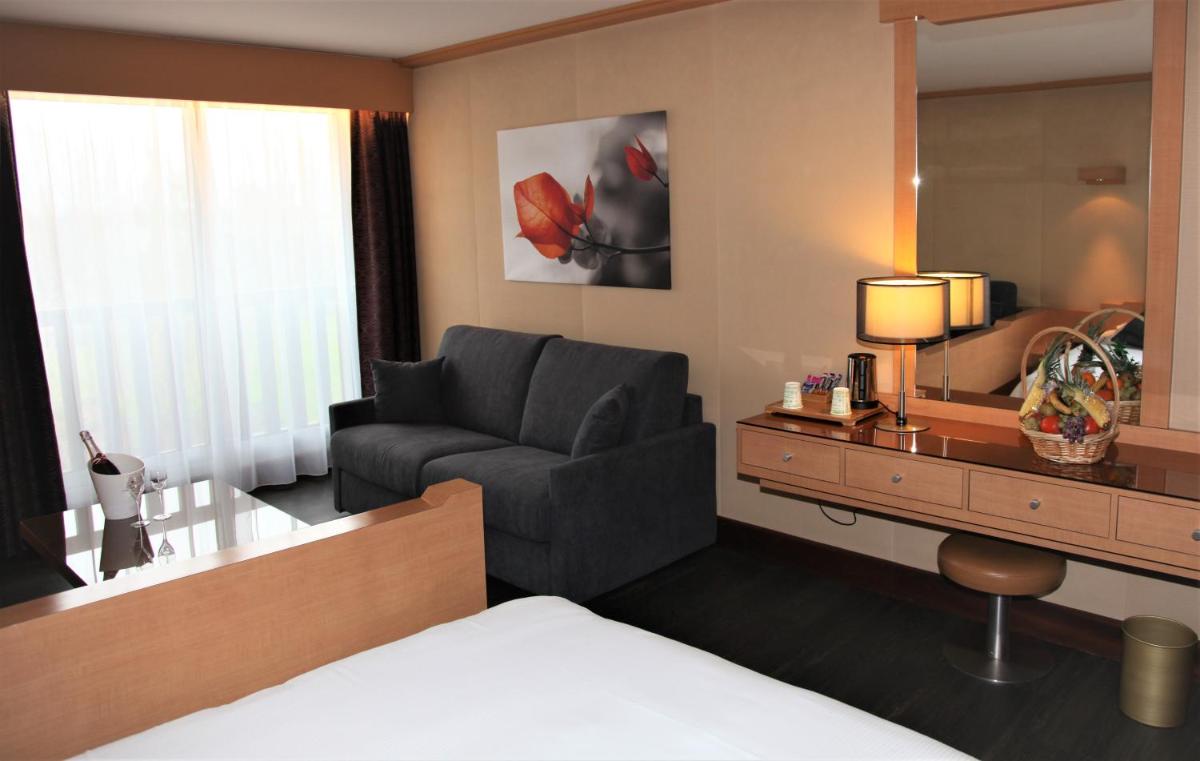 Un ou plusieurs lits dans un hébergement de l'établissement Amirauté Hôtel Golf Deauville