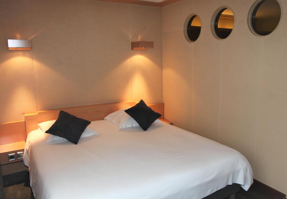 Un ou plusieurs lits dans un hébergement de l'établissement Amirauté Hôtel Golf Deauville