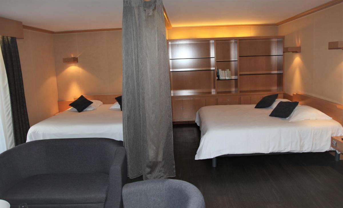 Un ou plusieurs lits dans un hébergement de l'établissement Amirauté Hôtel Golf Deauville