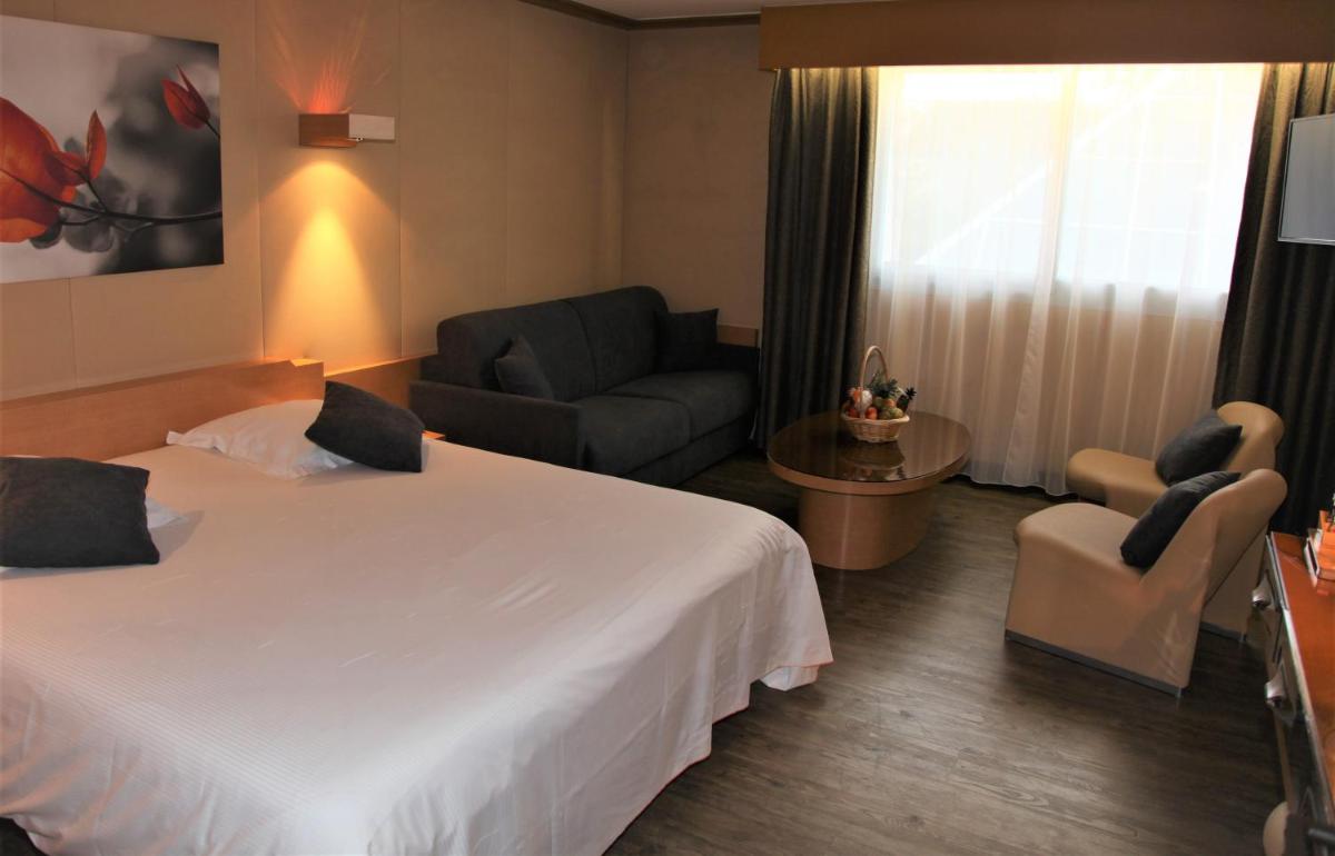 Un ou plusieurs lits dans un hébergement de l'établissement Amirauté Hôtel Golf Deauville