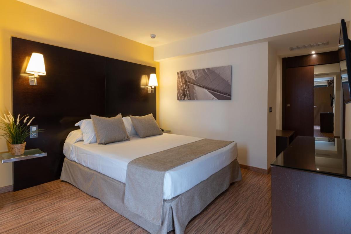 Cama o camas de una habitación en Nautic Hotel & Spa