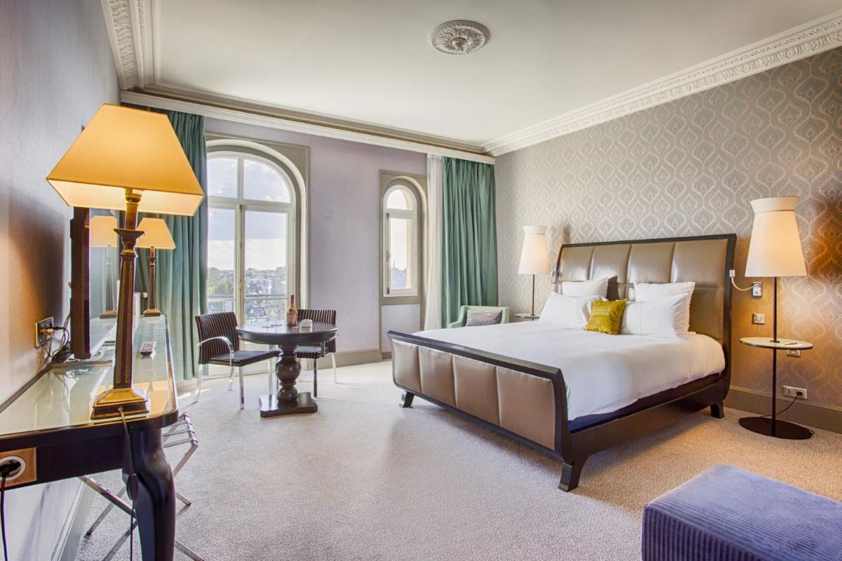 Un ou plusieurs lits dans un hébergement de l'établissement Le Grand Hotel de Cabourg - MGallery Collection