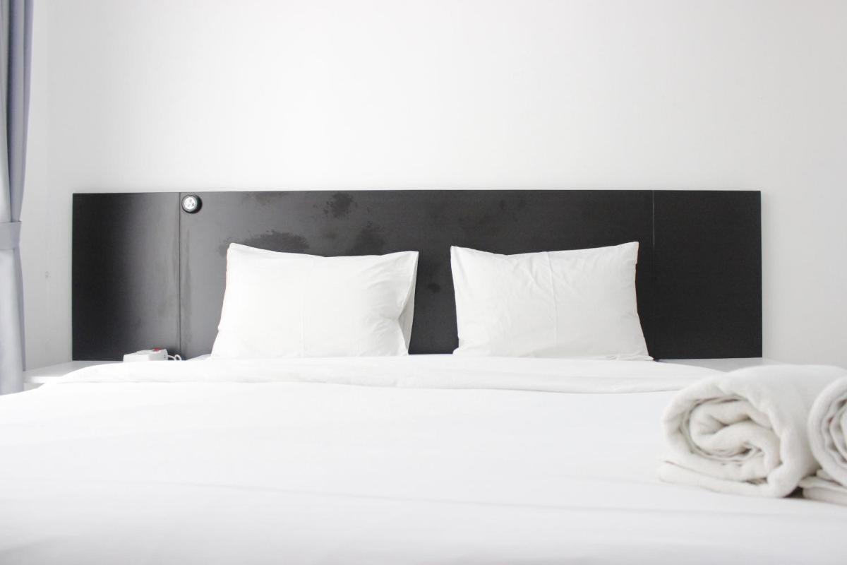 Monochrome Style Studio Room @Grand Asia Afrika Apartment By Travelio - Housity